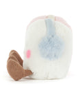 The Amuseables Toastie Pink And White Marshmallows plush by Jelly Cat Inc. is a soft, white toy with a pastel blue patch, pink blush, and brown floppy ears, resembling sweet pink and white marshmallows.