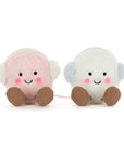 Two Amuseables Toastie Pink and White Marshmallows by Jelly Cat Inc.—adorable round plush toys with smiling faces, blushing cheeks, brown feet, and fuzzy earmuffs—make a perfect cozy gift for any winter collection.