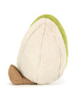 Meet the adorable Amuseables Horatio Pistachio by Jelly Cat Inc.—a plush toy shaped like a pistachio nut, featuring a light beige shell, green interior, and brown textured spot, shown here from the back.
