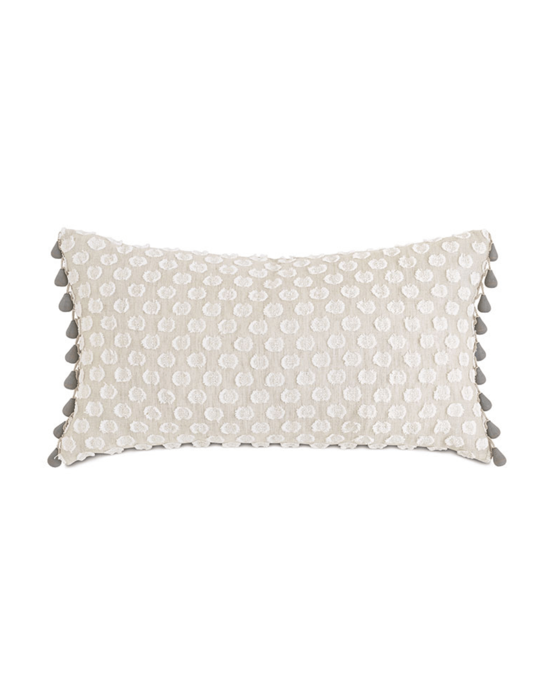 A rectangular beaded trim decorative pillow from Eastern Accents with a sequined white front and black tassel accents on the edges, set against a plain Arizona-style background.