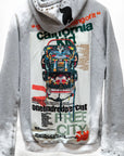 The Free City Backpack Homestud Bleachout Hoodie features a SUPERVINTAGE HEATHER BLEACHOUT gray, metal-studded hood, bold “California,” NHM “MAKE A BACKPACK” graphic on the back, Art + Commerce logo, and signature FREECITY DOVE motif.