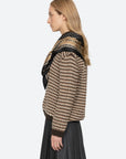 Sea New York DECLAN short-sleeve polo sweater and pleated skirt styled with scarf, shown in profile against plain background.
