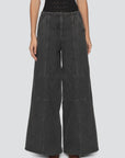 Sea New York Zayna wide leg jeans with contrast stitching, modeled against a simple neutral backdrop.