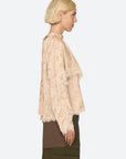 Sea New York Shay Lace LS Top and layered skirt in profile, featuring delicate lace and modern styling.