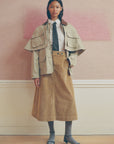 Sea New York corduroy midi skirt in beige styled with a jacket and polka dot tie for a modern, chic look.