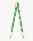The Crossbody Strap S25 by Clare Vivier is made from cotton webbing with a green and white checkered pattern on light fabric, featuring two adjustable gold-tone buckles and clips to easily convert any accessory into a stylish crossbody or shoulder bag.
