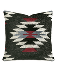 Introducing the ST-DEC-342 Fortnum Kilim by Eastern Accents, a square decorative pillow showcasing a woven tribal motif and geometric pattern. This exquisite piece is crafted in charcoal velvet, featuring a black background adorned with symmetrical diamond and triangular shapes in white, red, and light blue. A Southwestern-inspired design perfect for enhancing any space.