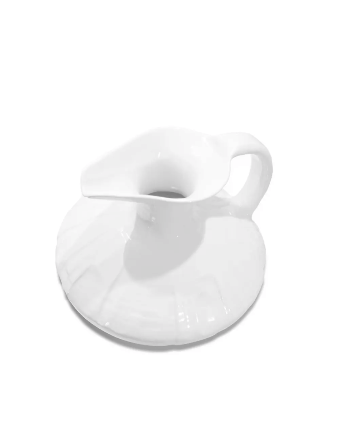A glossy white ceramic Pitcher No. 431 from Montes Doggett, with an innovative design featuring an integrated coaster attached to its base, set against a white background in a Scottsdale Arizona bungalow.