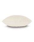A single Mar Cream Pillow with a rough texture, shaped like a long oval, displayed against a plain white background in a Scottsdale Arizona bungalow by Eastern Accents.