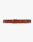 The Eye Opener by Mother is a vintage brown cow leather belt featuring an ornate brass buckle, tooled patterns, and colorful beaded designs at both ends, displayed on a white background.