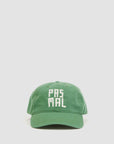 The Clare Vivier Baseball Hat PasMal is a green cotton cap with "PAS MAL" in bold white letters on the front, shown against a plain light background. It features an adjustable strap for a comfortable fit.