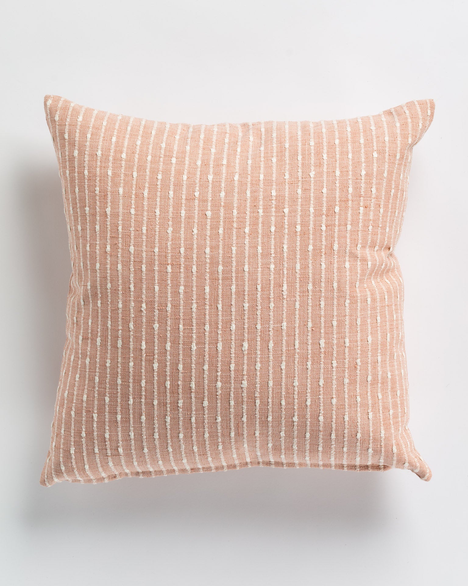 Gabby&#39;s Hopscotch Blush 26x26 decorative pillow with a salmon pink and white striped pattern, featuring textured vertical dashes aligned along the stripes, displayed in an Arizona style on a white background.
