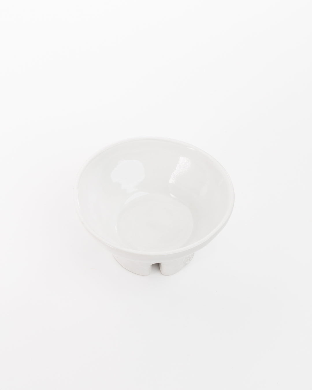 A simple white ceramic Catchall Bowl No. 257 from Montes Doggett positioned on a plain white background. The bowl's interior is visible, showing a plain and clean surface.