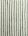 Textured fabric with vertical stripes alternating between a plain beige color and a detailed, thin blue thread pattern, reminiscent of the serene interiors typical of a Gabby Bones Blue Spruce Pillow 26x26 bungalow in Scottsdale, Arizona.