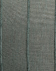 The Hilo Stripe Blue Spruce Gr-3 Pillow by Gabby features a textured green fabric with vertical seams, creating a woven pattern that enhances depth. This custom-made pillow insert adds structure and style to any chic bungalow setting.