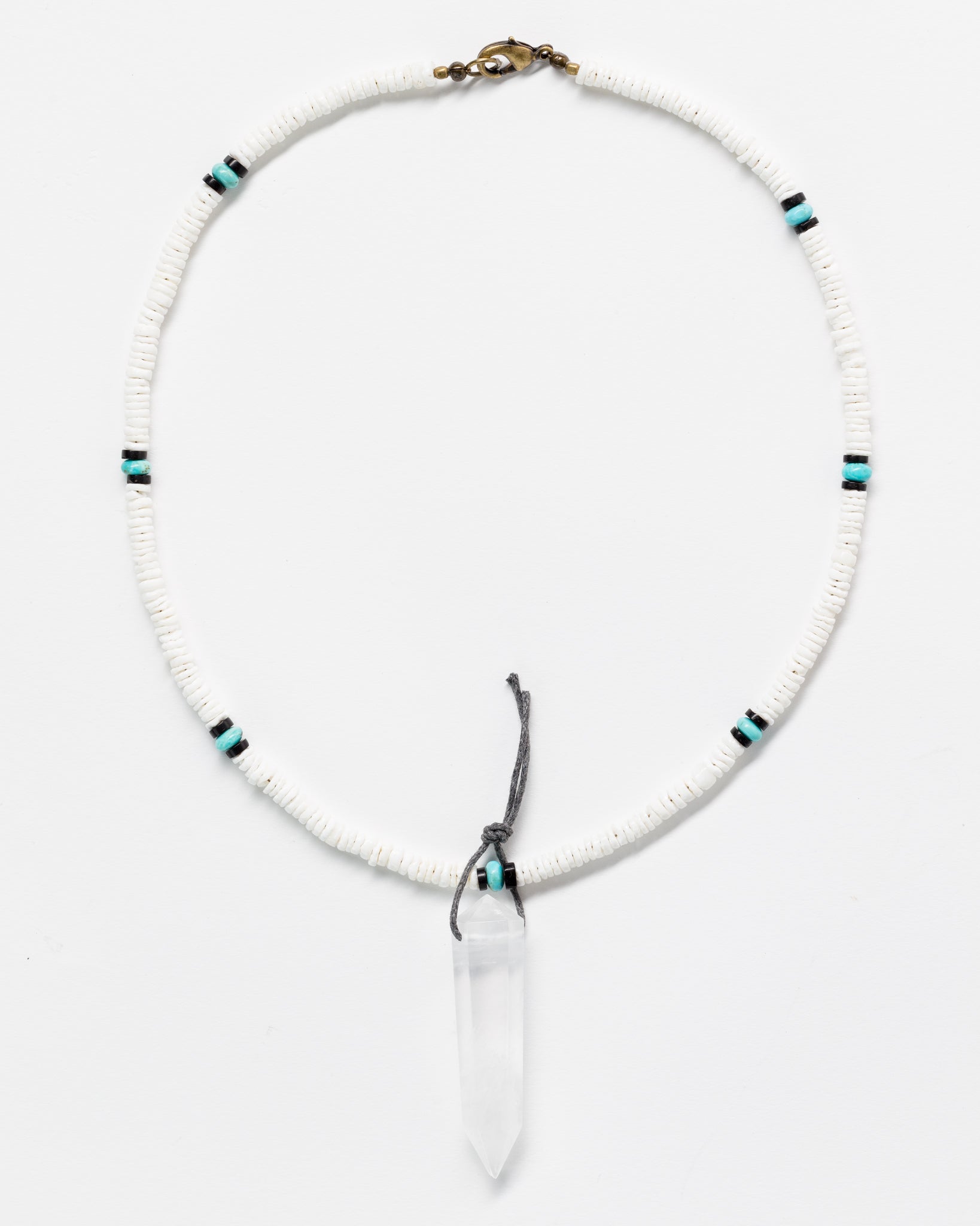 A Designs By Raya necklace with a White Designs By Raya pendant and small beads, featuring a mix of Arizona turquoise and white colors, set against a plain white background.