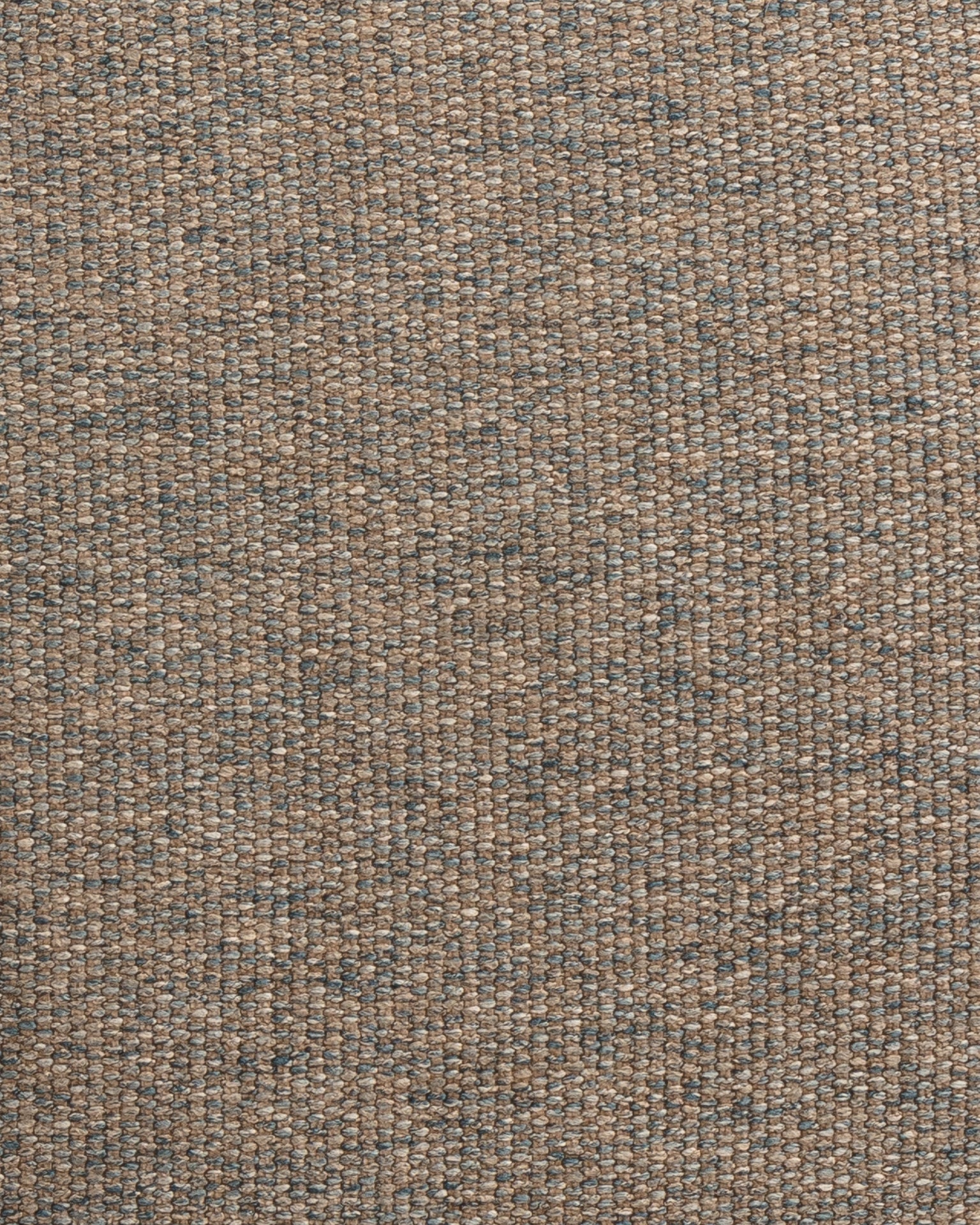 Close-up of a woven fabric with a tight, interlocking pattern. The Idgie Blue Spruce 24x24" pillow features a mixture of brown and gray threads, creating a textured and slightly speckled appearance. This Gabby exclusive captures the intricate details and variations in color and weave perfectly.