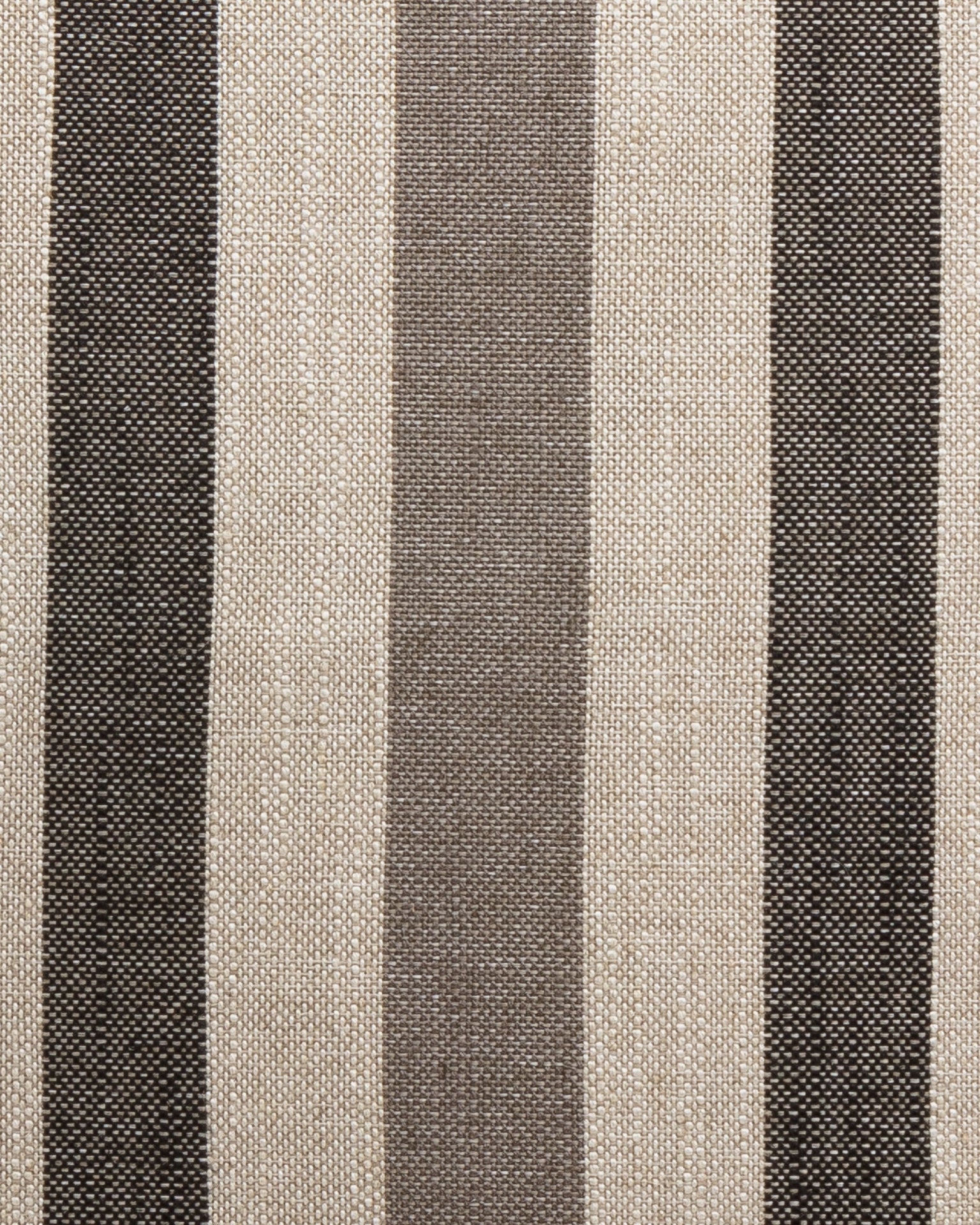 Close-up of the Gabby Tri-Stripe Earth 24x24" pillow showcasing its vertical stripes in alternating colors of black, beige, and dark brown. The woven fabric texture provides a slightly rough appearance. The pattern is evenly spaced and consistent throughout the image.