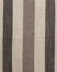 Close-up of the Gabby Tri-Stripe Earth 24x24" pillow showcasing its vertical stripes in alternating colors of black, beige, and dark brown. The woven fabric texture provides a slightly rough appearance. The pattern is evenly spaced and consistent throughout the image.