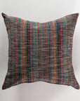 The Custom 3 Pillow 28x28 by Pindler is a square pillow designed with a woven, multicolored striped pattern incorporating shades of blue, red, and tan on a light background. It provides both comfort and support while adding an elegant touch to any decor.