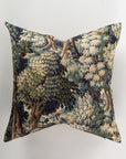 Introducing the Custom 3 Pillow 28x28 by Pindler, a luxurious euro pillow adorned with a detailed tapestry of a dense, leafy green forest. This design combines shades of blue, beige, and brown featuring various trees and foliage set against a neutral background to provide both comfort and style.