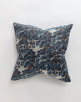 The North Oaks Pillow by Norwalk features a dark blue and white leafy pattern, adding luxurious elegance to any space. Shown against a plain white background.