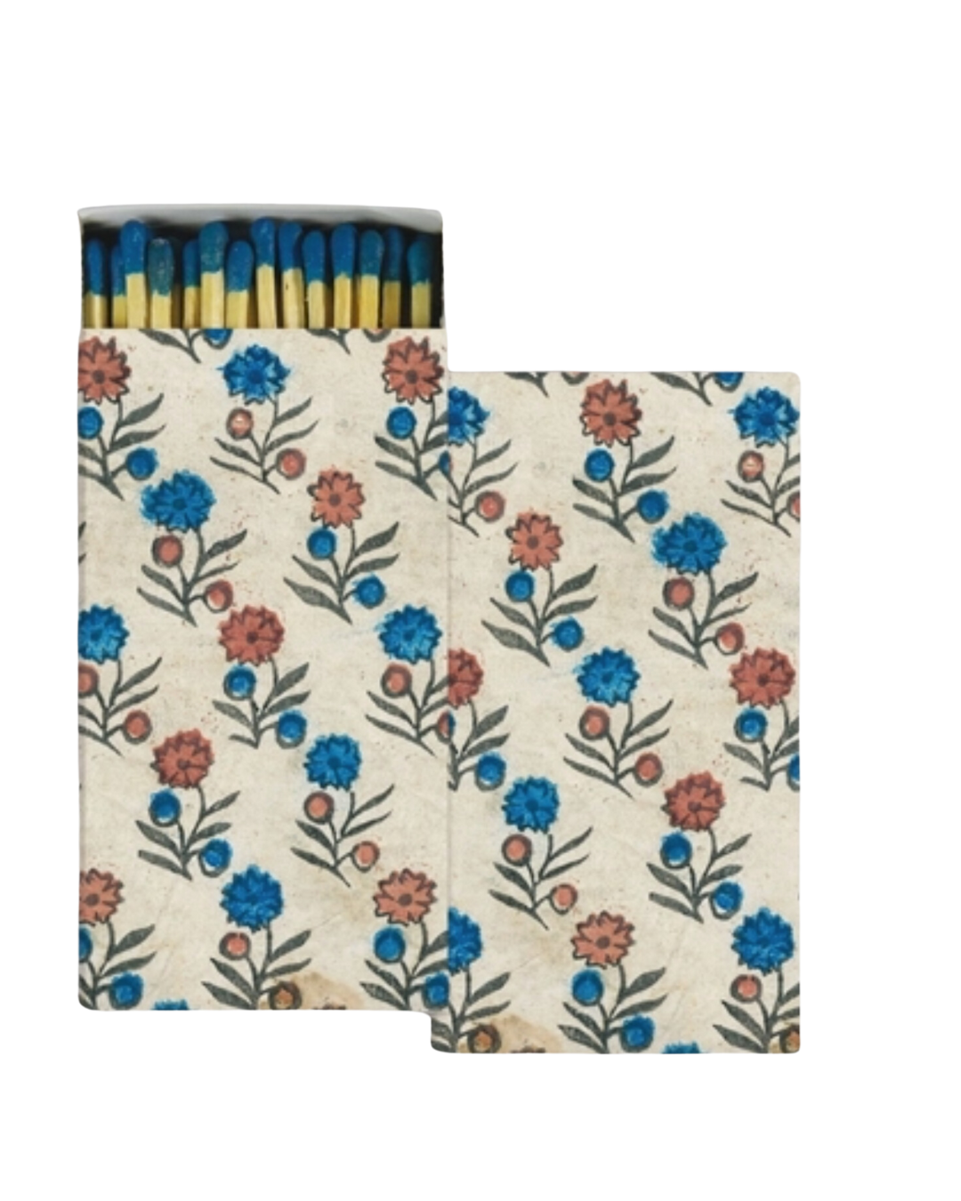 A small matchbox of HomArt safety matches with a floral print featuring blue and orange flowers on a beige background. The striking surface is visible with several unused yellow matchsticks peeking out, reminiscent of the vibrant sunsets in Scottsdale, Arizona.