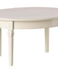 The Maileg Furniture round white wooden table by Maileg features four turned legs, making it ideal for dollhouses or a Maileg Mouse setup. Shown against a plain white background.