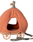 The Maileg Furniture by Maileg is a pumpkin-shaped orange pet bed with a fabric stem, plastic wheels, and a floral-pattern leash—perfect as dollhouse furniture or for your Maileg Mouse, resembling a charming carriage.