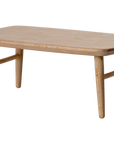The Maileg Furniture by Maileg is a charming small wooden table with four angled legs and a smooth rectangular top, ideal as dollhouse furniture for your Maileg Mouse. Displayed against a plain white background.