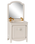 The Maileg Sink Dresser by Maileg features a white cabinet, gold faucet, and arched mirror—ideal for bringing Mouse Hole Farmhouse charm to whimsical dollhouse bathroom scenes.