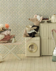 Maileg ironing mouse with iron and ironing board in a charming miniature laundry room setting.