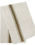 The Caravan Marseille Linen Towel Set-2 features folded beige towels with dual dark green stripes, ideal for bringing a rustic accent to your kitchen.