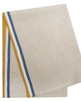 The Caravan Normandy Natural Towel Set-2 features folded beige linen towels with vertical mustard yellow and blue stripes along one edge, inspired by tricolor tea towels, displayed on a white background.