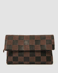 The Clare Vivier Carryall Clutch w/ Tabs showcases a dark brown and black checkerboard pattern, fold-over flap with magnetic closure, minimalist design, and chambray-lined interior for an elegant touch.