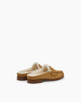 The Rag & Bone Carter Mule is a tan Italian-milled suede slip-on moccasin slipper with white fur lining and brown soles, shown on a plain white background.
