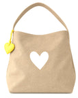 Tan hobo tote with heart cutout and yellow leather heart charm, Kerri Rosenthal Imperfect Heart for Bungalow Furniture.