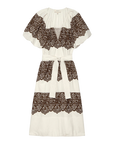 The Fairground Dress by The Great Inc. is a white knee-length style with short sleeves, wide horizontal western lace print bands, and a matching fabric belt at the waist.