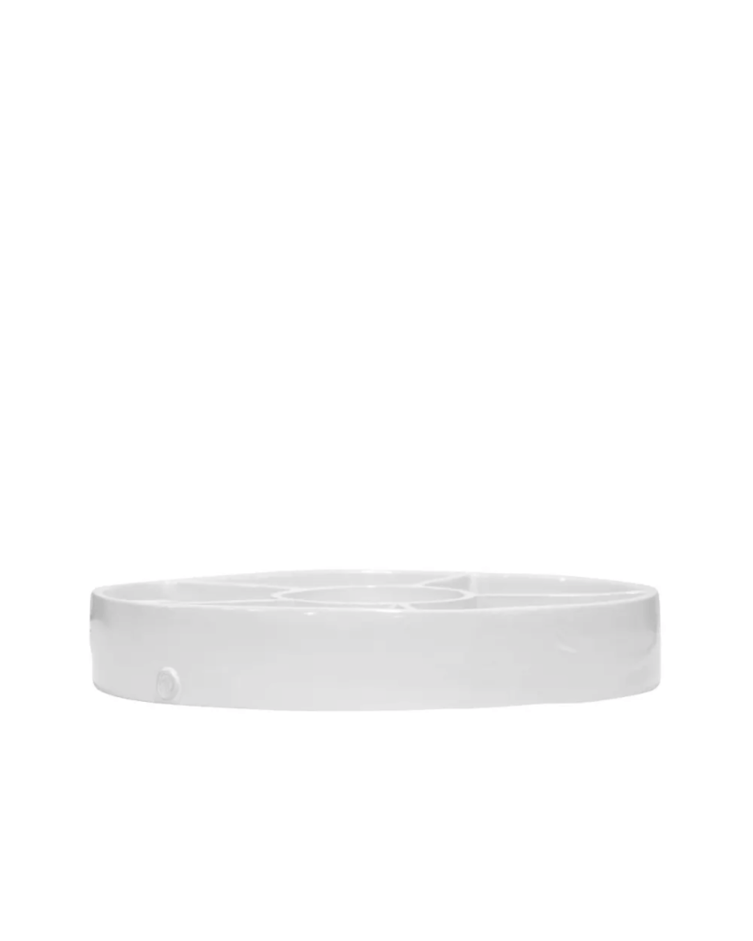 A simple, circular, white plastic Montes Doggett petri dish styled like an Arizona bungalow on a plain white background.