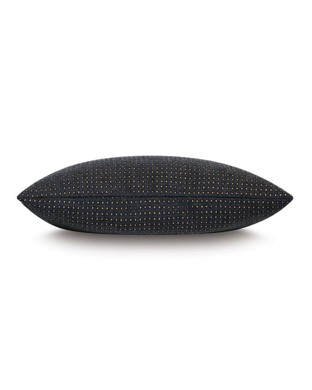 A black Eastern Accents Octa Wool Pillow with a dotted pattern, photographed against a white background in a Scottsdale Arizona bungalow.