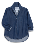 The Frank & Eileen Eileen 26 is a relaxed-fit, long-sleeve denim shirt with a front pocket, rolled cuffs, visible white buttons, and a frayed curved hem for casual California style. The label reads “Frank & Eileen EST 1947.”.