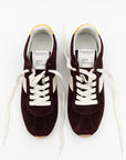 A pair of Essex Sneakers by ONCEPT, crafted from burgundy Italian suede with white laces, side panels, and yellow-accented heel tabs, are displayed side by side on a white background. The insoles are branded "ONCEPT.