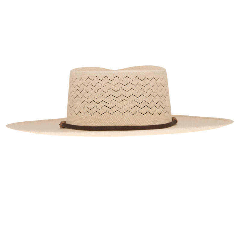 A beige Ninakuru Paloma Hat with a decorative ventilated pattern and a thin brown leather band, isolated on a white background.