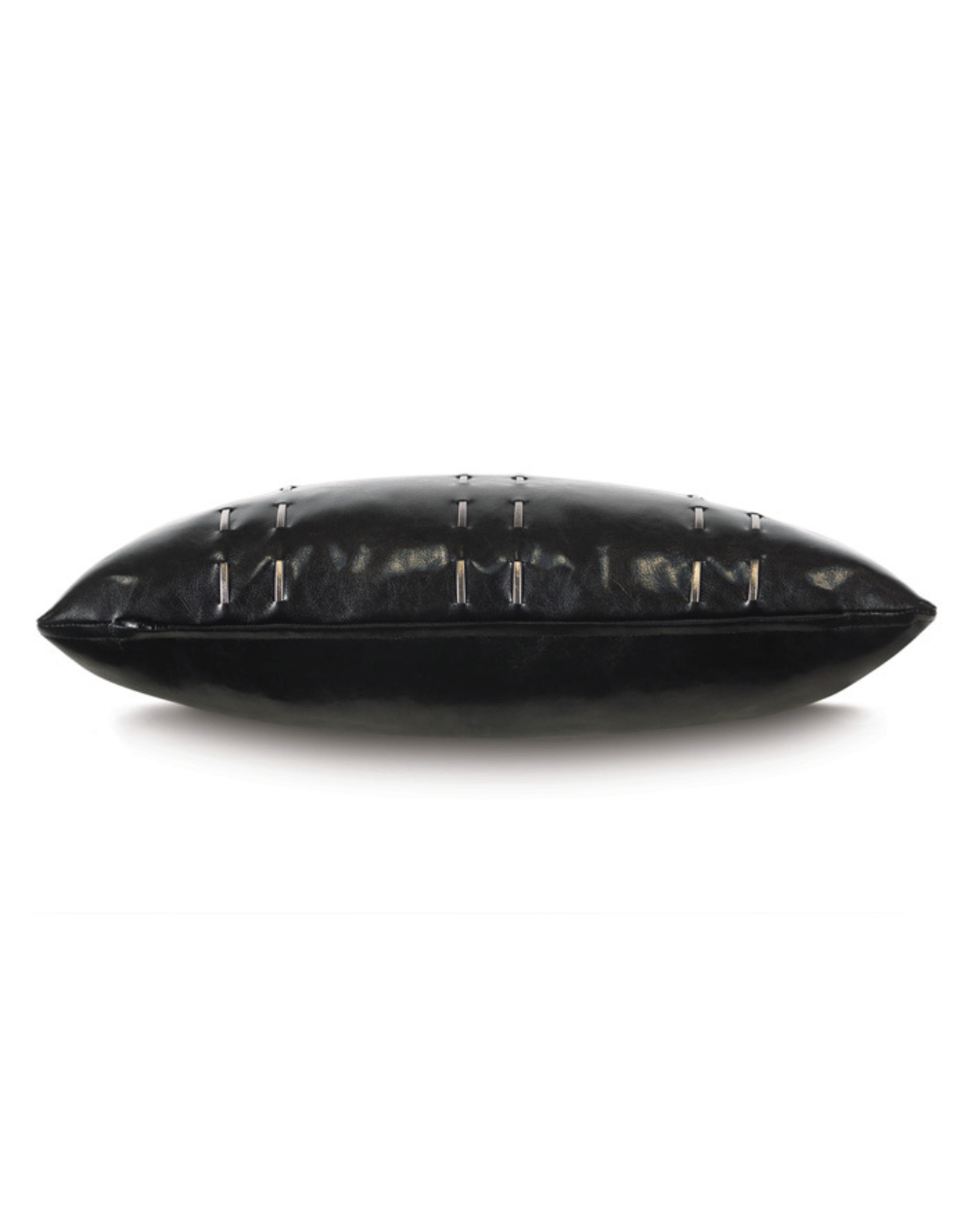 A Muse Pillow by Eastern Accents, a black leather bolster pillow with a row of metallic studs along its midline, displayed on a white background, designed in Arizona style.