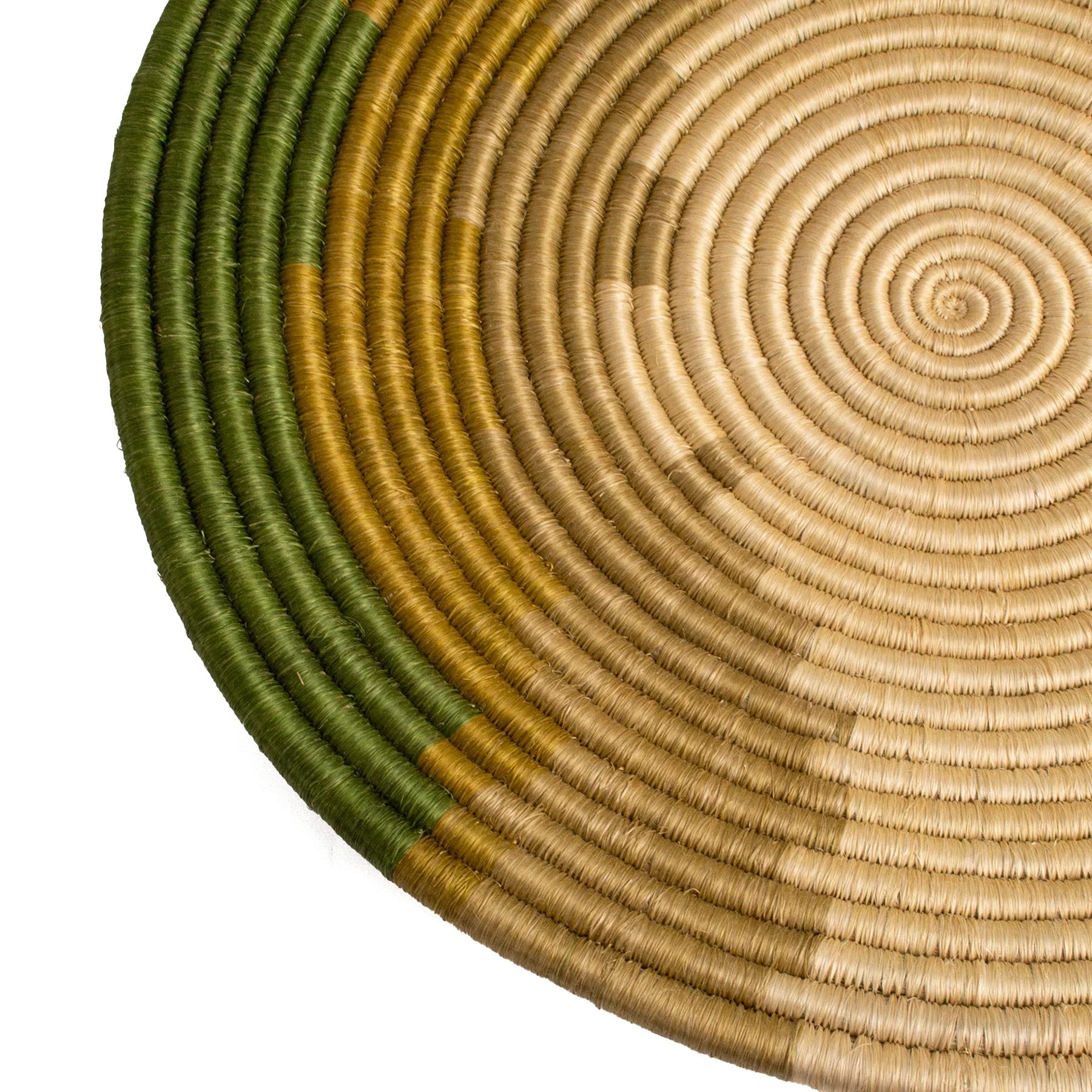 Circular woven mat featuring concentric circles in shades of beige and green, with a gradual transition in colors from the center to the perimeter, perfect for a Scottsdale Arizona bungalow by Kazi Goods.