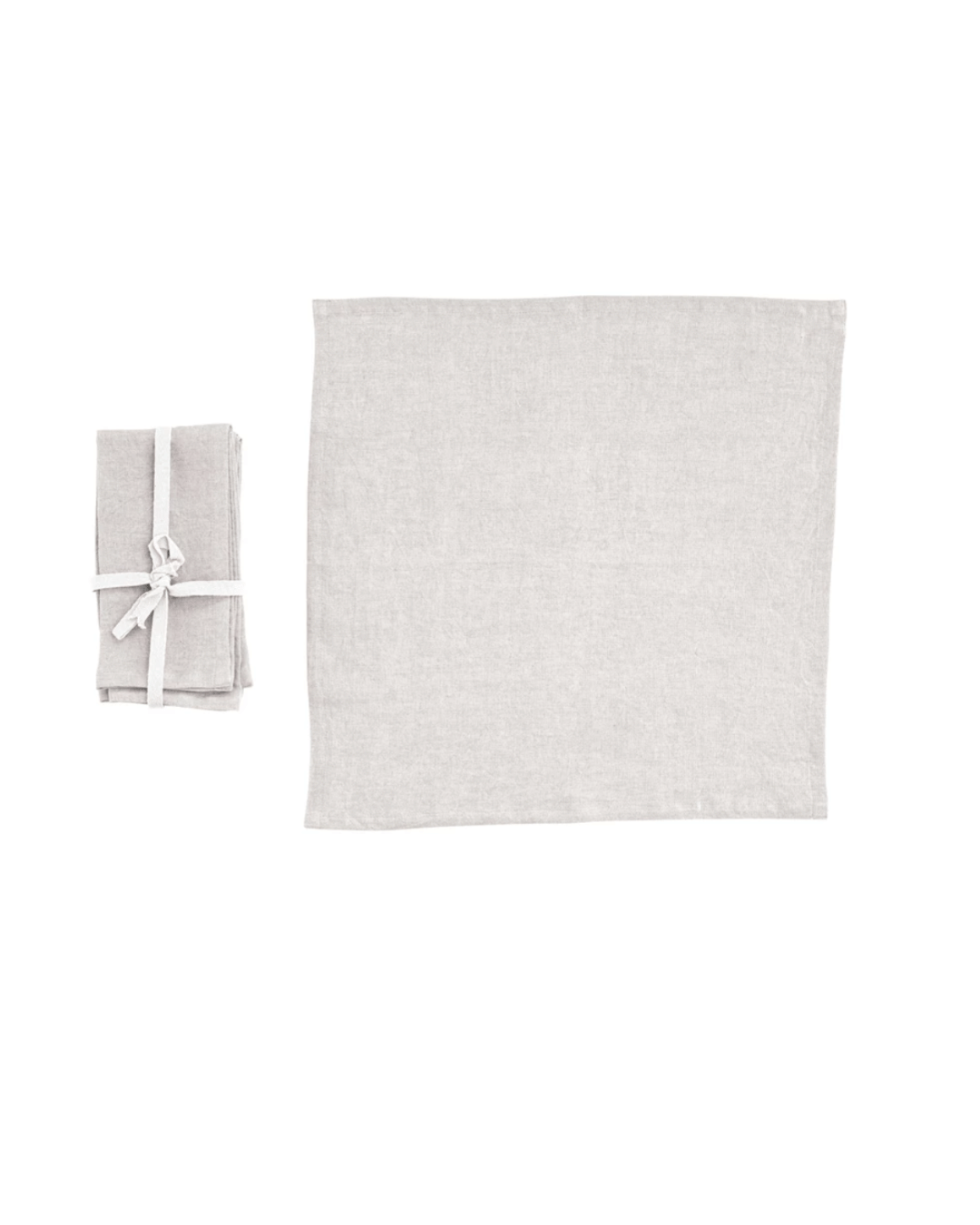 A neatly folded gray Linen Napkins Ecru S/4 tied with a white ribbon beside an unfolded matching napkin on a plain white background, evoking the simplistic elegance of a Scottsdale Arizona bungalow. - Creative Co-op