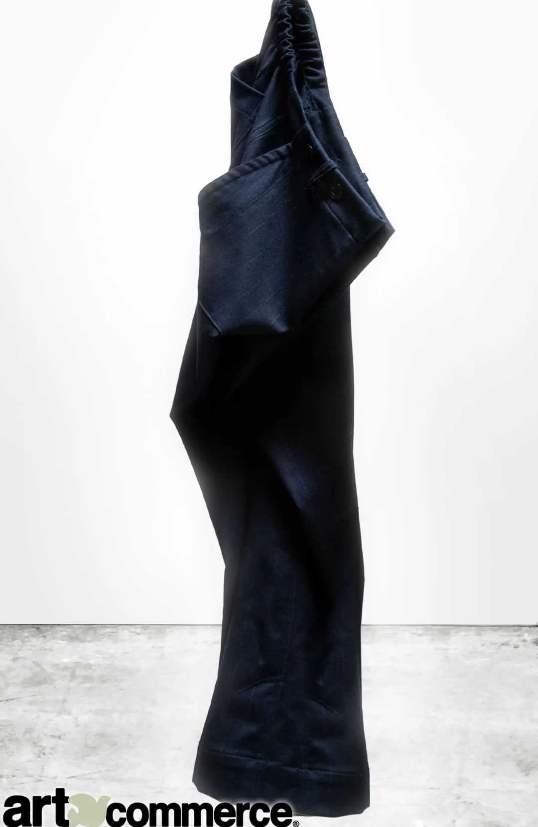 Favolamove Cashemere French Sailor Pant by Free City (sparrow, LLC) stands upright on a concrete floor against a plain white background, appearing as if worn by an invisible figure. The "art+commerce" logo is at the bottom left corner.