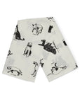 White cotton tea towel with playful illustrated dog tricks, Fishes Eddy, kitchen accessory, 20x28 inches, machine washable.
