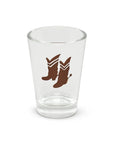 Clear shot glass with two brown cowboy boots design, by Fishes Eddy, made from recycled glass.