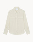 White cashmere long-sleeve button-up shirt with chest pockets by KUJTEN, true to size.